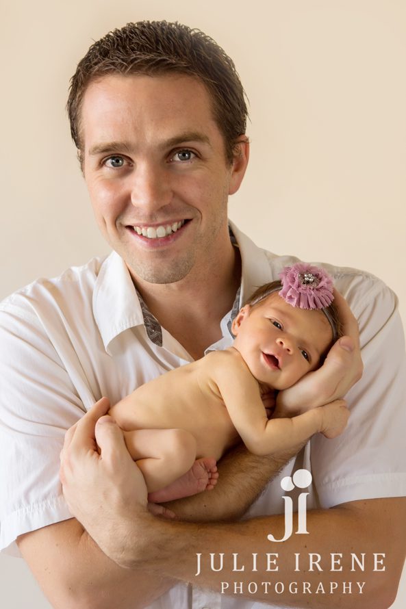 father daughter smile newborn photography