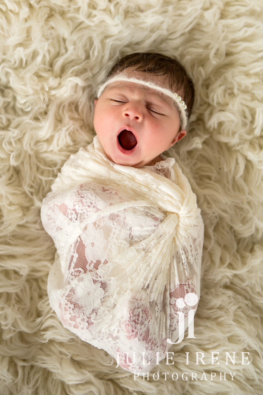 Yawning newborn baby