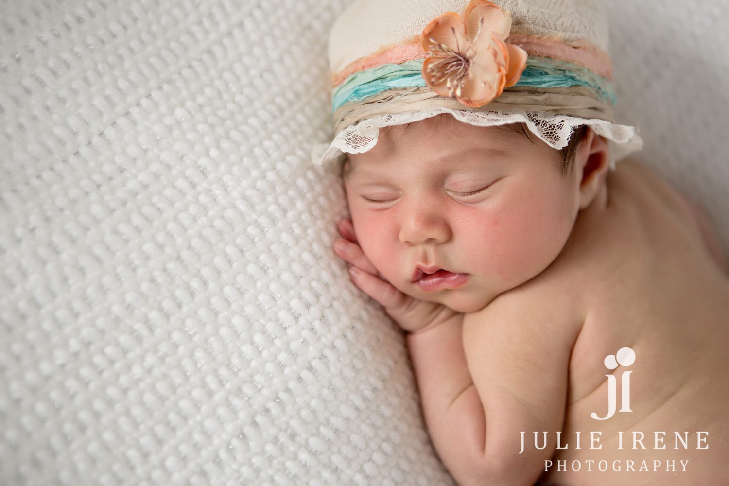 Sleeping baby with hat