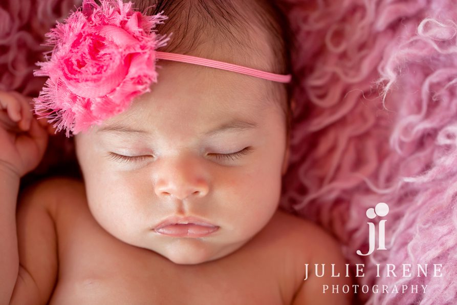 newborn baby girl flokati pink closeup