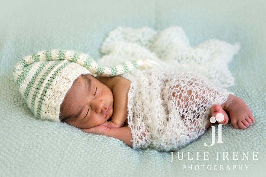 cream and green sleeping hat newborn boy photography