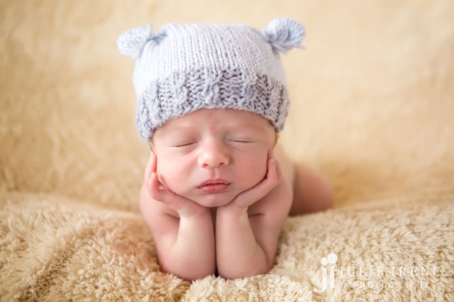 newborn froggy pose blue hat