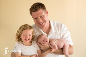 daddy with his girls newborn baby girl photo