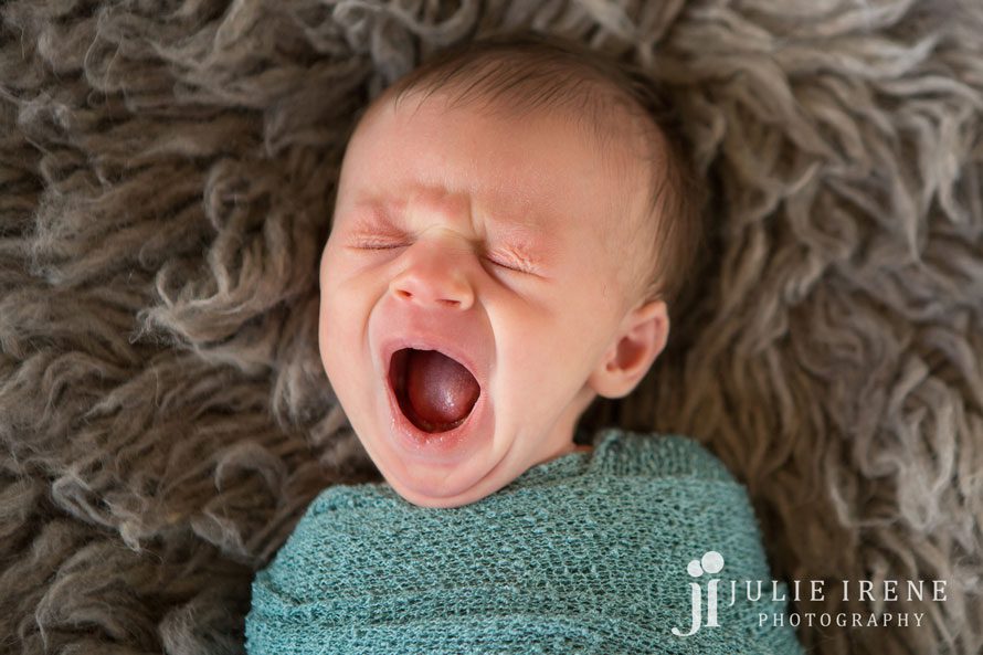 big yawn for newborn baby boy photo