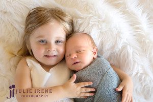 toddler sister and newborn baby boy photo
