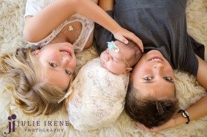 siblings with newborn baby girl photo