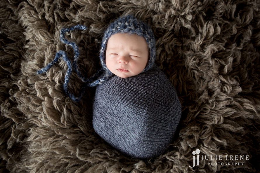 all wrapped up newborn baby boy in blue