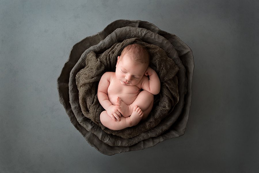 fine art baby boy with dark browns and gray