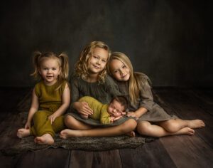 gorgeous fine art newborn boy with his 3 sisters