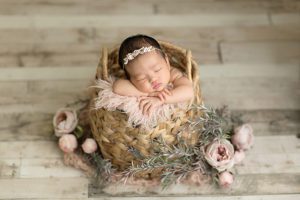 light pink florals and neutral tones newborn portrait