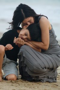 tender moment mom and son beach photo session