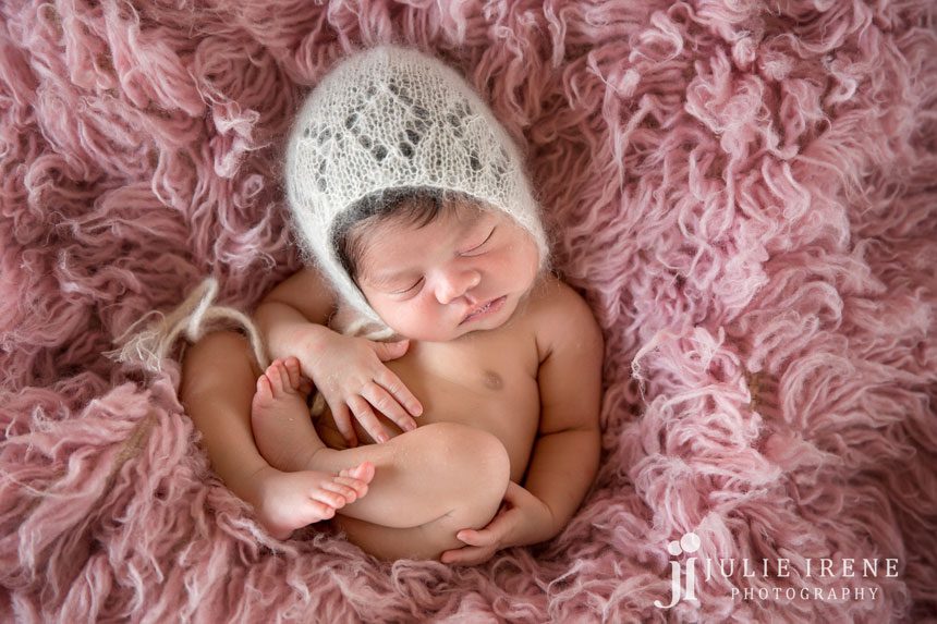 all curled up amari in pink flokati baby photo