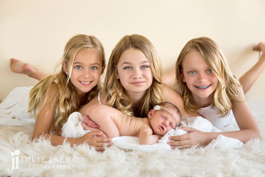 Newborn baby girl with her 3 older sisters 1