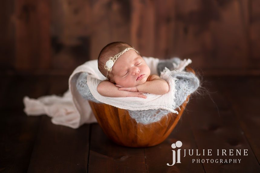 baby bucket girl gray wood background photo