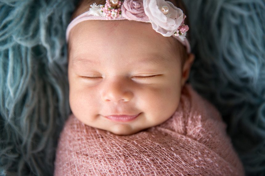 close up sweet smile newborn baby san clemente