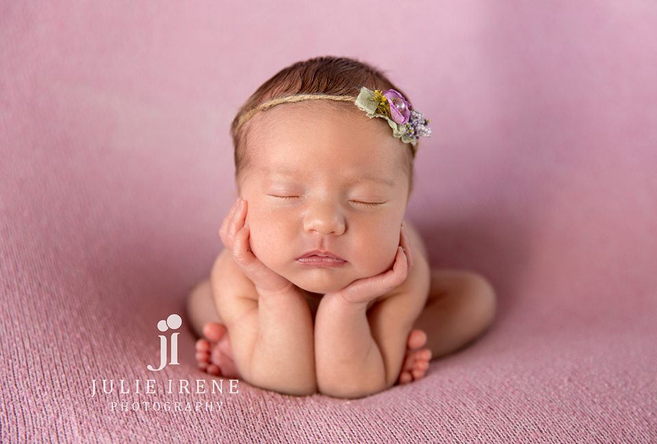 san clemente photographer poses newborn girl in froggy