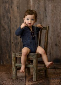 vintage school chair with one year old boy