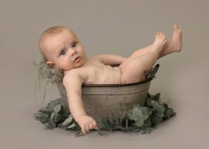 little guy sitting in tub