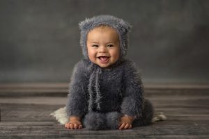 baby boy in blue dressed as a teddy bear