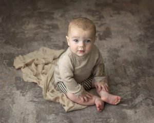 neutral colors of a baby boy in a portrait