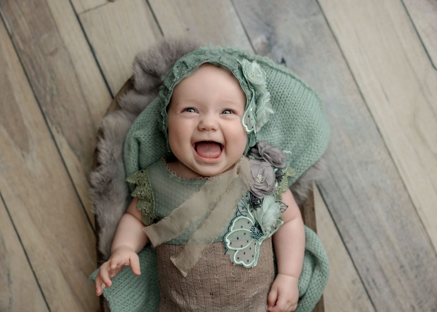 Huge smile on a 4 month baby for a photography session in Orange County