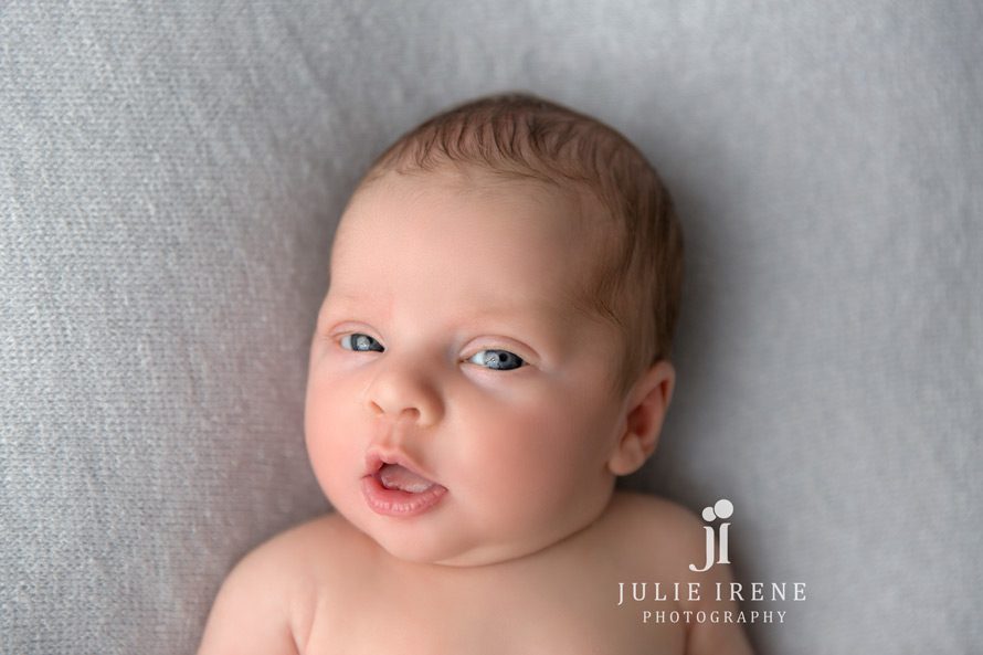 eyes open newborn photography head shot