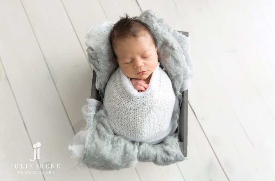 wrapped gray white newborn photo session
