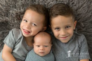 awake newborn with siblings julie irene