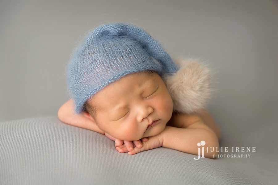 cute blue santa hat on a newborn boy