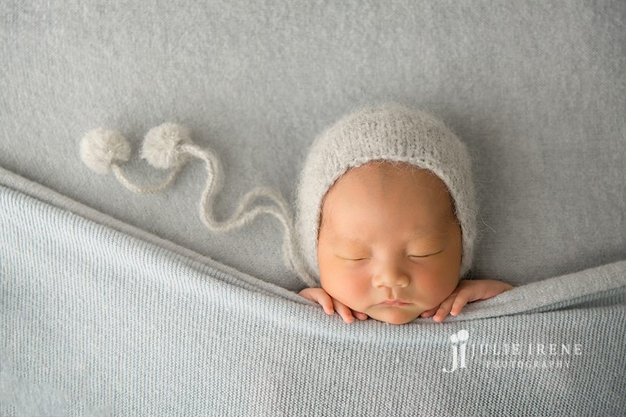 baby sleeping with a knit hat
