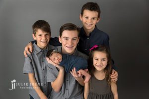large sibling photo with newborn baby