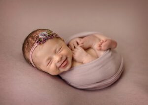 cute smile on baby wrapped