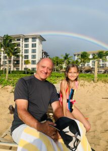 dad and granddaughter with rainbow