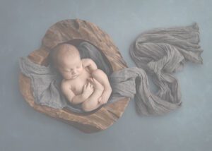 baby boy in blue newborn