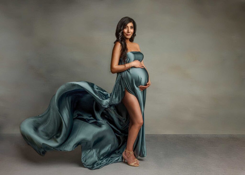 Pregnant woman in silk gown maternity session OC